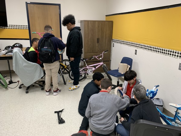 boys fixing bikes