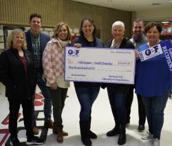 Teacher receiving big grant check