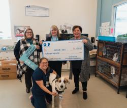Lisa Cox presents $1000 grant check to April Smith
