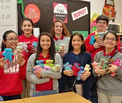 Brandenburg Middle School students pose with their "Sew Much Fun" creations